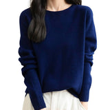 Woman wearing a lightweight 100% merino wool navy blue crewneck sweater