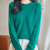 women's green merino wool crewneck cardigan sweater front view